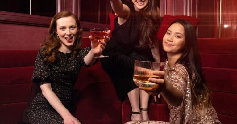 Athletic Textiles - Women drinking whisky cocktails in a bar or nightclub