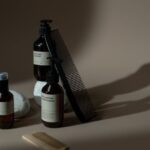 Haircare Products - Photo of Combs Near Bottles