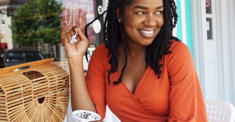 Handbag Styles - Woman Wearing Orange V-neck Overall Dress Sitting on Chair