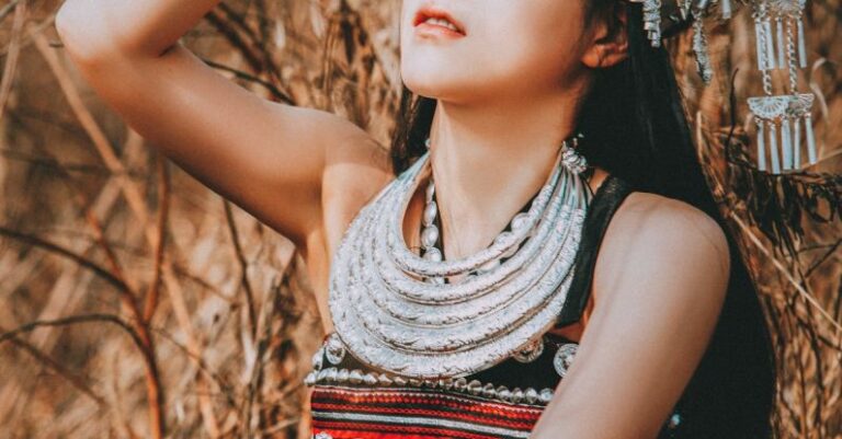 Statement Jewelry - A woman in traditional clothing and headdress