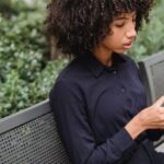 Street Style Pieces - Crop African American woman having snack