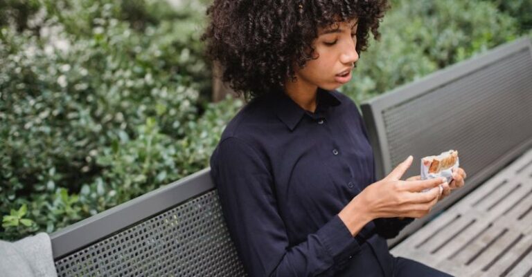 Street Style Pieces - Crop African American woman having snack