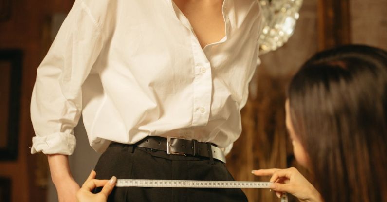 Vintage Designer Clothing - A Woman Looking at the Atelier while Measuring Her Waist