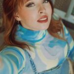 High Fashion Look - Woman in Blue Sweatshirt Reaching a Handrail