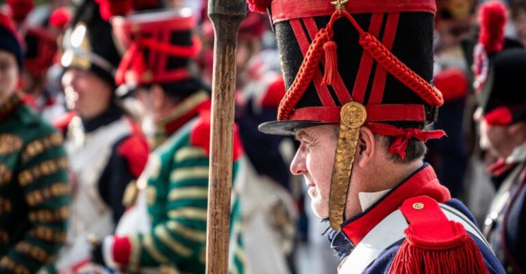 Military Uniforms - A man in a military uniform holding a stick