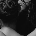 Headdresses - Women Hugging During a Concert