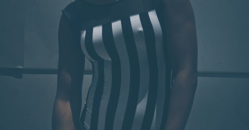 Swimwear Trends - Confident black lady standing near wall