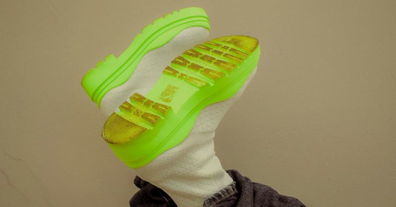 Footwear Fashion - A person wearing neon green sneakers